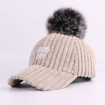 China COMMON Winter Fur Baseball Cap Solid Color Corduroy Stripe Warm Female Baseball Cap With Pom Poms for sale