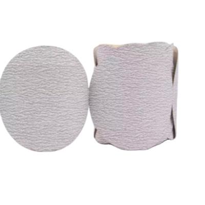 China PSA Sand Roll Paper White Sandpaper Aluminum Oxide Sand Disc Polishing Gold Sanding Roll for sale