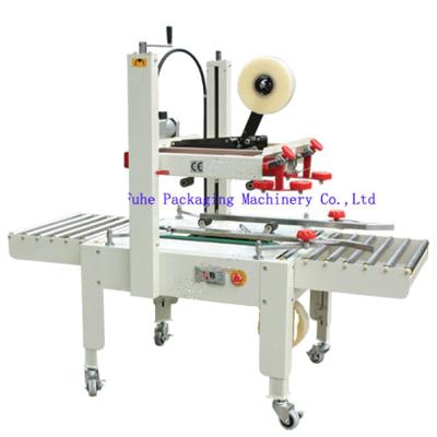 China FXJ-5050 Automatic Beverage Flaps Folding Carton Sealing Machine Top And Bottom Sealer for sale