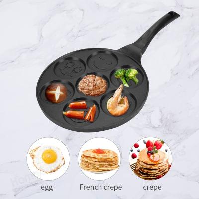 China Factory Price Viable Kitchen 7 Holes 26cm Smiley Face Egg Frying Breakfast Cooking Non Stick Pan for sale