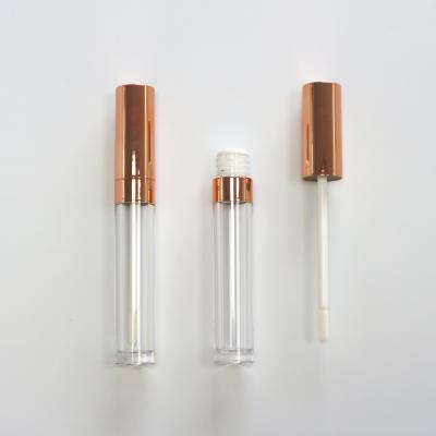 China Cosmetics Metallic Pink Lip Gloss Container 5ml Round Shape Tube Lip Gloss Empty Gold Case for sale