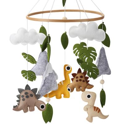 China Cute Crib Mobile Baby Felt Dinosaurs with Arms Wood Stand Newborn Boy Dino Nursery Decor for sale