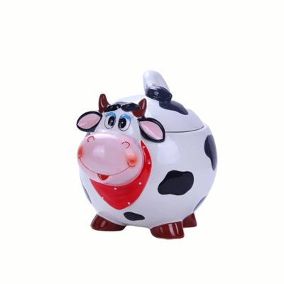 China Viable Handmade Ceramic Shape Cookie Jar Cow Design Wholesale Fashion Candy Jar For 2021 New Years for sale