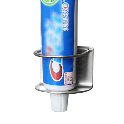 China Wall Mounted Self Adhesive Stocked Toothbrush Holder Stainless Steel Toothpaste Holder for sale