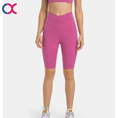 China Popular Women's Breathable Fitness V-Waist Cross With Phone Pocket Sports Biker Shorts Recycled Nylon Blend Running Pants for sale