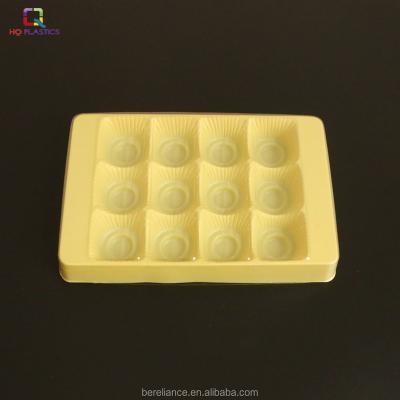 China Recyclable yellow color plastic packaging tray with lid for pastry and chocolate for sale