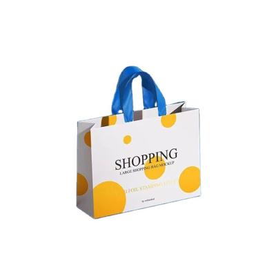 China Recyclable Wholesale Cheap Eco - Friendly Paper Gift Bags White Foldable Paper Bag For Gift for sale