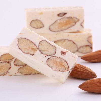 China Cranberry cashew cranberry cashew nougat and low sugar almond hard chewy candy and soft almond candy milk candy from Taiwan for sale