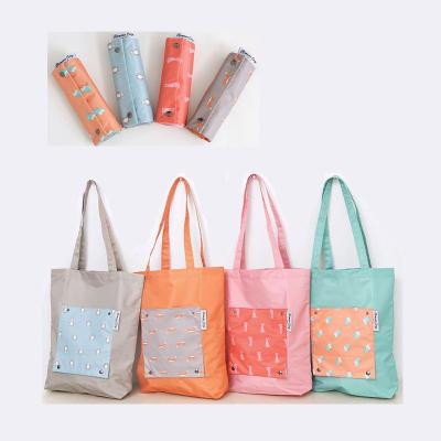 China 100% Eco-friendly Easy Carry Foldable Reusable Roll Up Shopping Bag Grocery Bag for sale