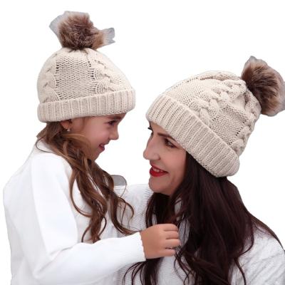 China JOINT Fashion Mommy and Me JOINT Beanie Hats Acrylic Cable Fur Pop Winter Warm Knitting Custom Hat for Mother Baby Set for sale