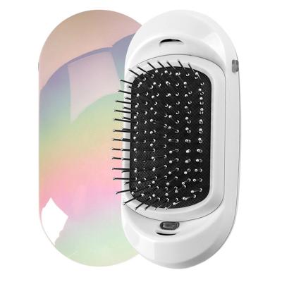 China 2022 Battery Operated Mini Ion Hair Brush Electric Professional Hair Brush Detangling Comb for sale