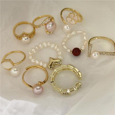 China FASHIONABLE baroque bead ring copper wire winding temperament torque rings small and cool design torque for sale