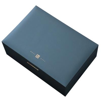 China Custom Luxury Blue Tea Book Shaped Box Gold Foil Embossed Magnet Paper Tea Gift Set Box With Foam Paper Tray for sale