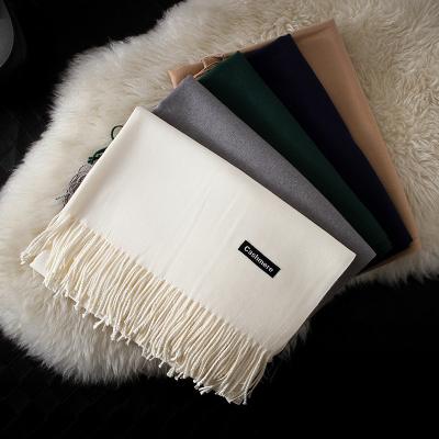 China New products eco-friendly pure color pure color eco-friendly cashmere scarf women's annual meeting LOGO imitation cashmere tassel tassel scarf for sale