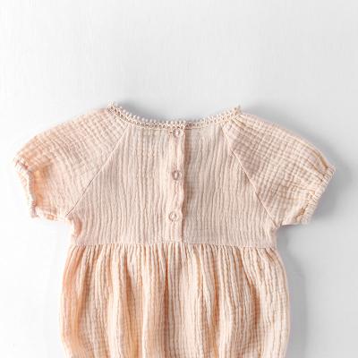 China Newborn baby playsuit long rompers short sleeve simple muslin color baby rompers for sale