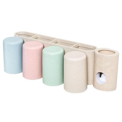 China Wholesale Viable Bathroom Wheat Straw Bottle Holder Storage Toothpaste Dispenser Toothbrush Sanitizer Holder for sale