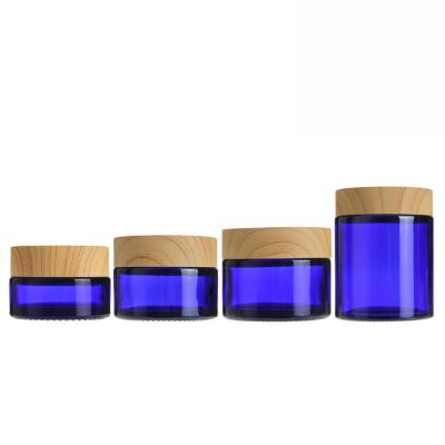 China Personal Care 20g 30g 50g Cosmetic Jar Blue Glass Jar Cosmetic Cream Jars Round Glass Bottle With PP Inner Liners for sale