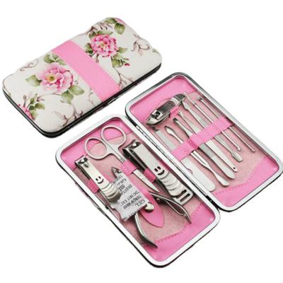 China Eco-Frendly Nail Care Kit Salon Tools 12 Pcs Pink Girls Manicure Pedicure Set With Flower Printing PU Case for sale