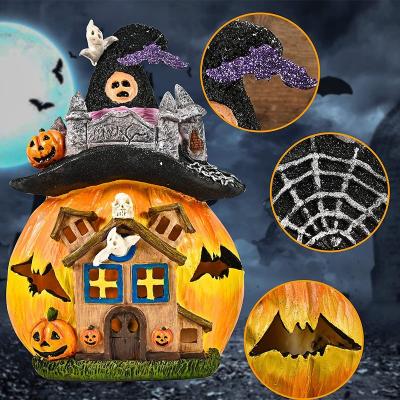 China Europe Halloween Pumpkin House Solar Lighted Resin Statue With Fairy Sculpture Pumpkin Witch Hat Cottage Decor Home Garden Decoration for sale