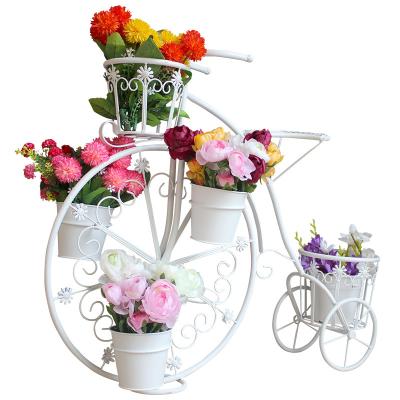 China Home iron bicycle flower stand outdoor creative flower pot decoration balcony garden floor flower pot rack for sale