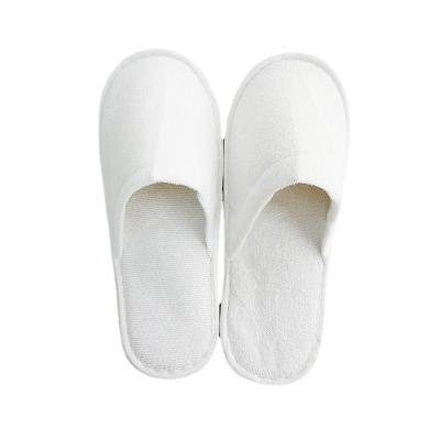 China Lightweight Disposable Plush Towel Nonwoven Fabric Hotel Canvas Slippers for sale