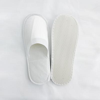 China Disposable Slippers Hospitality Hotel Guest Room Lightweight Nonwoven Home Slippers for sale