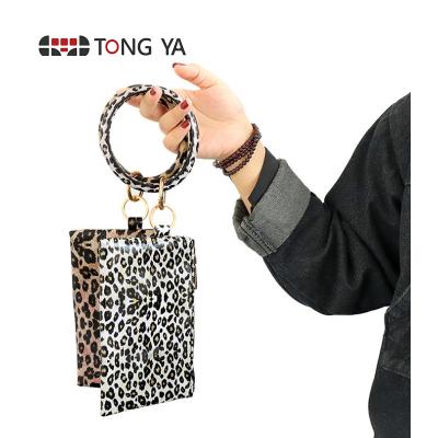 China Waterproof Hot Selling Multifunctional Round Leather Matching Wallet Girl Purse PU Key Chain Bracelet Wristband Card Holder For Women for sale