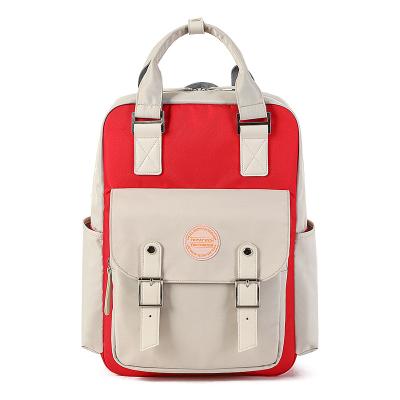 China Korean donut waterproof backpack primary school female backpack to reduce the burden of ridge students backpack for sale