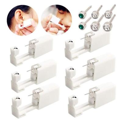 China Machine gun tragus helix piercing gun/romantic portable ear cartilage/jewelry piercing kit for sale