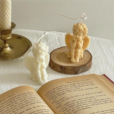 China Handmade Handmade Customize Beautiful Baby Angel Shape Ceramic Scented Candle Angel Art Soy Wax Candles for sale