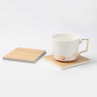 China Sustainable 4 Pieces Square Bamboo Dining Table Teacup Pads Coaster Set With Stand Bamboo Wood Table Mat Placemats Customized Color for sale