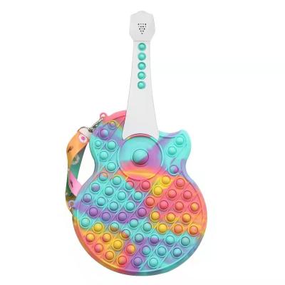 China 2022 new rainbow design school fashion guitar bag children stir silicone poppings sound bag for girl for sale