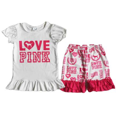 China Casual In Running Baby Pink Outfit Fashion White Short Sleeves Letter Shirt Ruffle Dog Shorts Outfit Kids Boutique Kids Set for sale