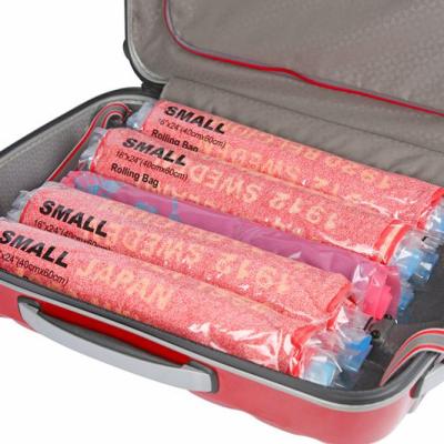 China Sustainable Travel Space Saver Bags - Roll Up Storage Bags - Compression Bags For Clothes - No Vacuum Or Pump Required for sale