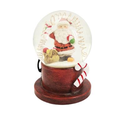 China Europe Resin Craft Christmas Snow Globe 100mm For Souvenir With Light And Music for sale