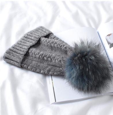 China Cozy Hot Sell Fur Ball Beanie Winter Hat With Removable Pom Pom Hat For Unisex for sale