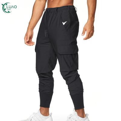 China Plus Size Polyester Quick Dry Mens Breathable Pants With Side Pockets Sweat Wicking Pants Fitness Athletic Running Wear For Gym for sale