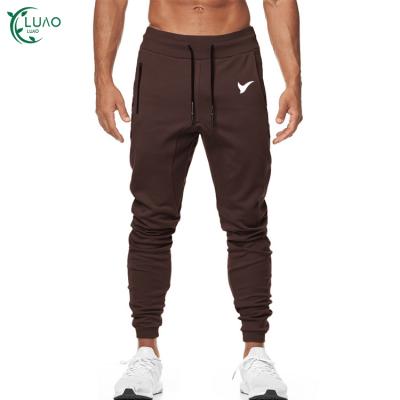 China Wicking Fashionable Sweat Tight Slim Men's Sports Breathable Pants With Zipper Pockets Comfortable Stretchy Fitness Wear For Gym for sale