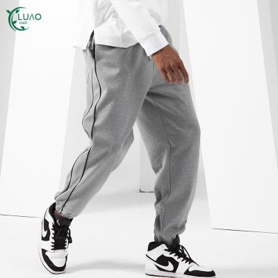 China Hot Sale Mens Breathable Pants With Double Reflective Stripes Sweat Wicking Workout Pants Breathable Running Jogging Bottoms for sale