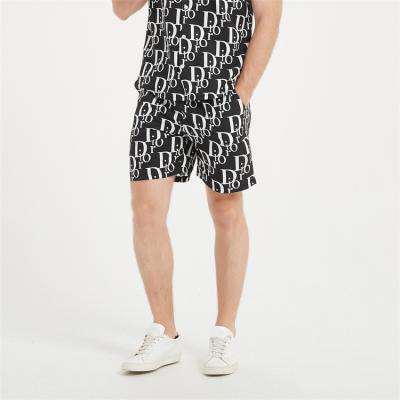 China Spring 2022 European casual men's straight tube Anti-wrinkle new summer beach and American printed loose shorts for sale