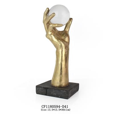 China Resin minimalist hand with crystal ball home and table decoration for sale