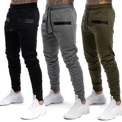 China New Muscle Fitness Pants Men's Breathable Sports And Leisure Stretch Slim Fit Pants Running Training Long Pants for sale