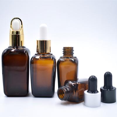 China Recyclable Custom Amber Glass Dropper Bottles Essential Oil Bottle For Packaging Skin Care for sale