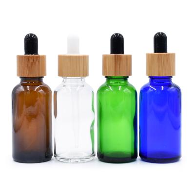 China Personal Care 10ml 15ml 30ml Eco Friendly Bamboo Dropper Frosted Essential Oil Bottles Serum Glass Bottles for sale