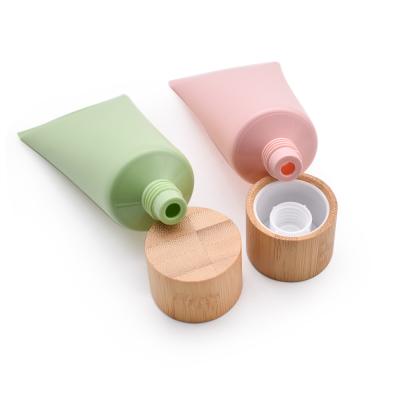 China Plastic Face Cream Hand Cream Tubes Cosmetic Bamboo Facial Detergent Lid Tubes For Cosmetics Packaging for sale