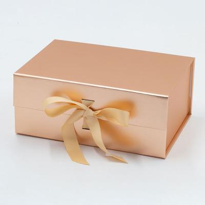 China Recyclable Custom Elegant Flat Pack Bulk Magnetic Closure Mounted Gold Gift Box With Ribbon Bow for sale