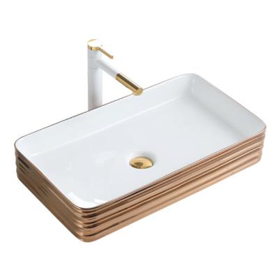 China Easy Clean Gold Plated Basins Golden Pias De Banheiro Douradas de Rose Sink Bathroom Art Ceramic Table Top Lavatory for sale