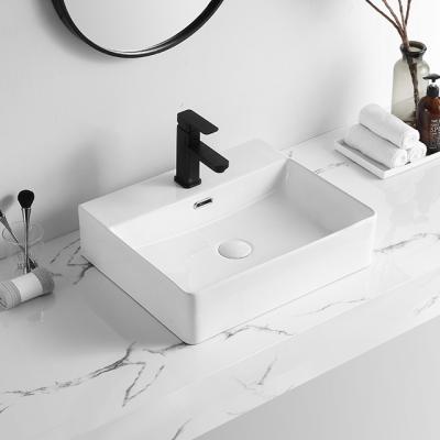 China Easy Clean Popular White Ceramic Rectangular Countertop Design Bathroom Basin Vessel Solid Outdoor Sink for sale