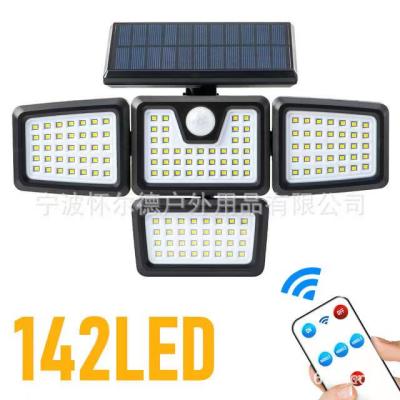 China 2021new Family Yard Lights Led Solar Motion Sensor Outdoor Four Head Wall Light For Home Yard Lighting for sale