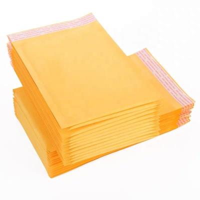 China Gloden Best Impact Resistance Kraft Paper Mailer Self Seal Shockproof Bubble Dampened Mailer for sale